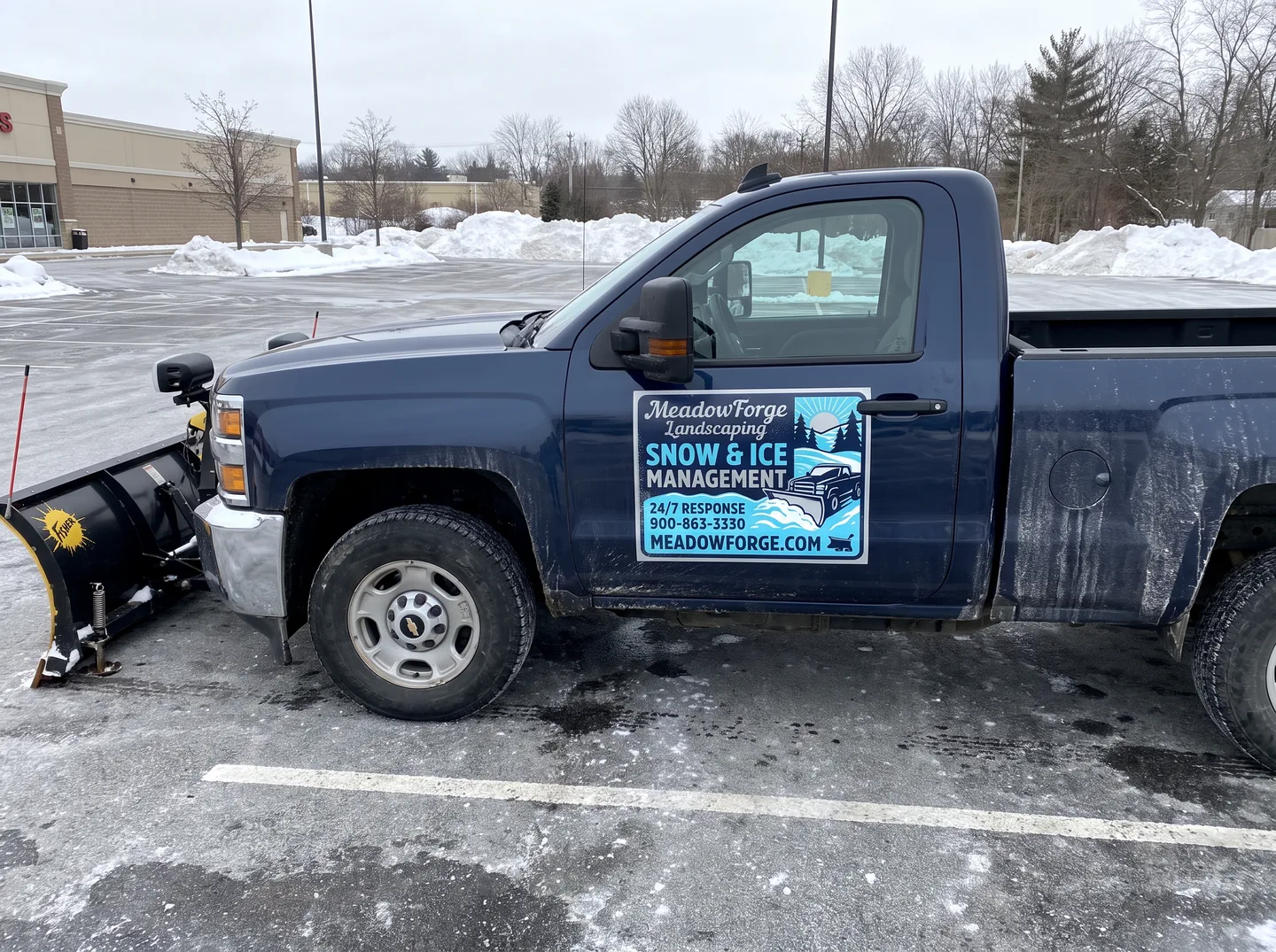 seasonal snow removal magnetic sign concept on a compatible steel pickup door